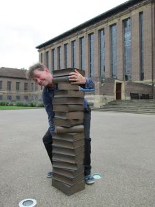 Author deposits his books at Cambridge University Library
